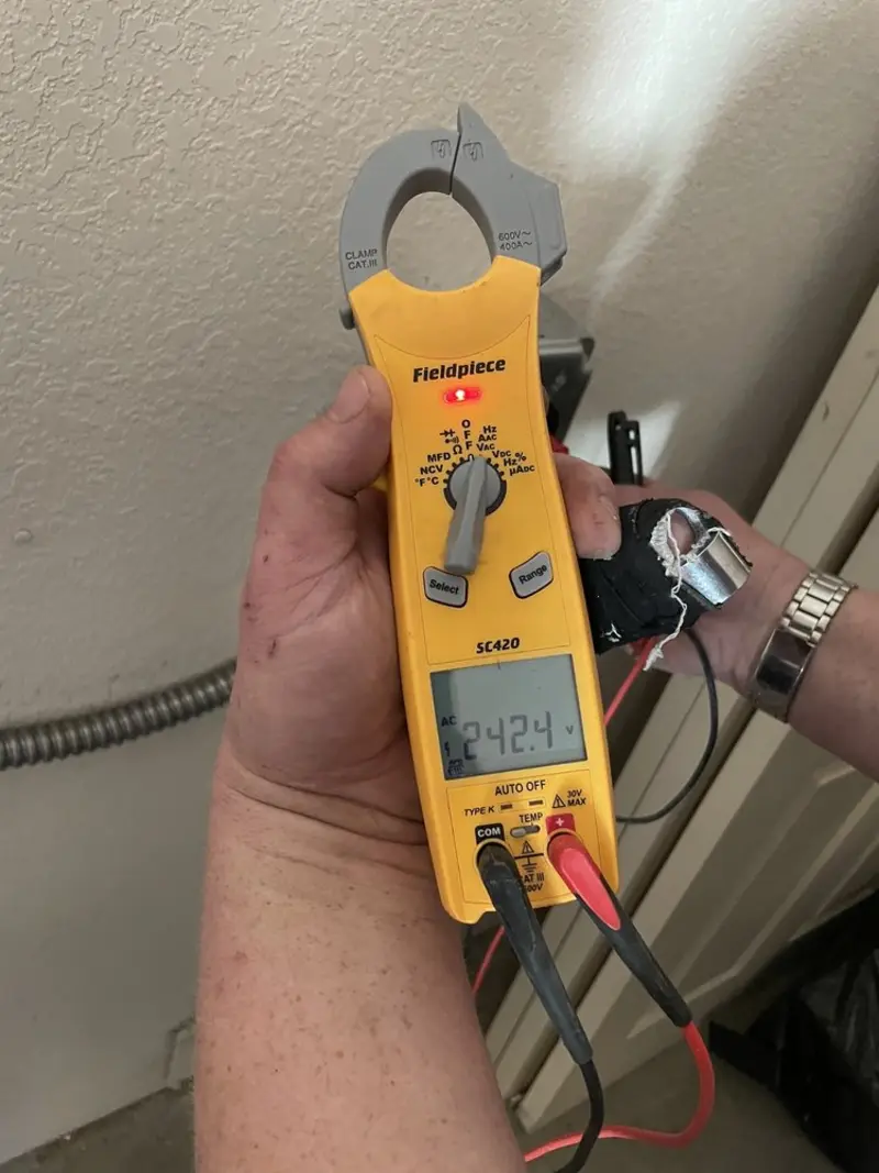 Voltage testing with clamp meter during Recessed Lighting Installation in Smyrna
